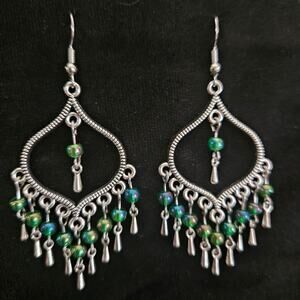 Antique silver arabesque and round iridescent green glass chandelier earrings